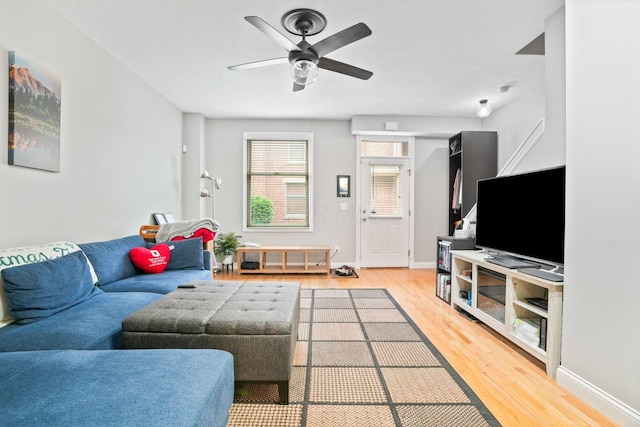963 Delaware Ave, Columbus, OH 43201 - living room with light wood-style floors, a ceiling fan, and baseboards