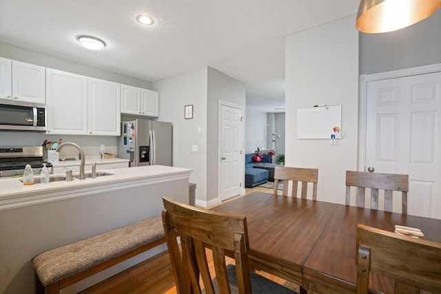 963 Delaware Ave, Columbus, OH 43201 - dining room featuring baseboards and light wood finished floors