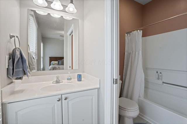 963 Delaware Ave, Columbus, OH 43201 - bathroom featuring connected bathroom, vanity, shower / bathtub combination with curtain, and toilet