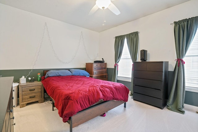 963 Delaware Ave, Columbus, OH 43201 - bedroom featuring light colored carpet, multiple windows, and a ceiling fan
