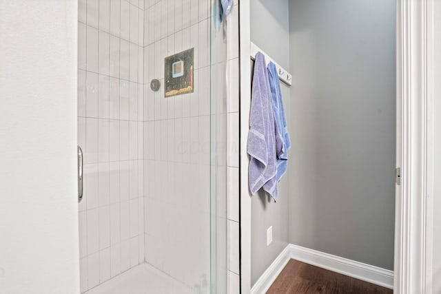 963 Delaware Ave, Columbus, OH 43201 - full bath featuring a shower stall, wood finished floors, and baseboards