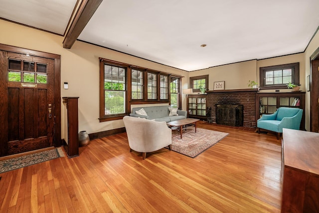 431 Glen Echo Cir, Columbus, OH 43202 - living area with light wood-type flooring, baseboards, a fireplace, and beam ceiling