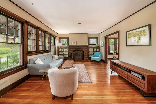 431 Glen Echo Cir, Columbus, OH 43202 - living area with light wood finished floors, baseboards, and a brick fireplace