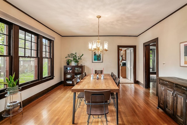 431 Glen Echo Cir, Columbus, OH 43202 - dining area featuring plenty of natural light, light wood-type flooring, a chandelier, crown molding, and baseboards