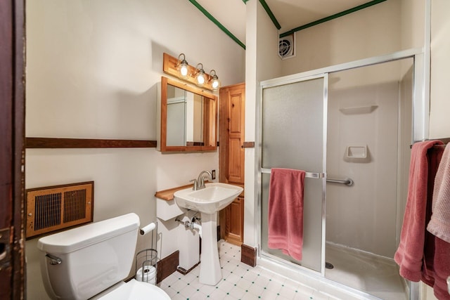 431 Glen Echo Cir, Columbus, OH 43202 - full bathroom featuring a stall shower, toilet, tile patterned floors, and a sink