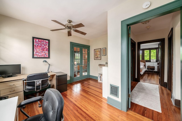 431 Glen Echo Cir, Columbus, OH 43202 - home office with french doors, light wood-style floors, ceiling fan, and baseboards