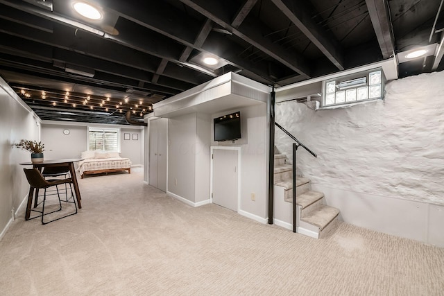 431 Glen Echo Cir, Columbus, OH 43202 - below grade area featuring stairs, plenty of natural light, and carpet