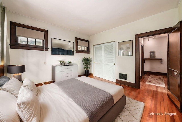 431 Glen Echo Cir, Columbus, OH 43202 - bedroom with baseboards, wood finished floors, and a closet