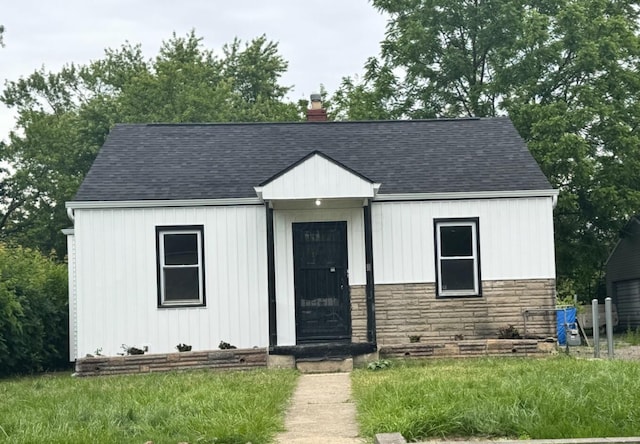 1794 Republic Ave, Columbus, OH 43211 - view of front of home featuring stone siding, a chimney, and a shingled roof