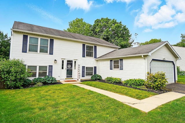 1707 Wessel Dr, Columbus, OH 43235 - view of front facade with an attached garage, a front lawn, and driveway