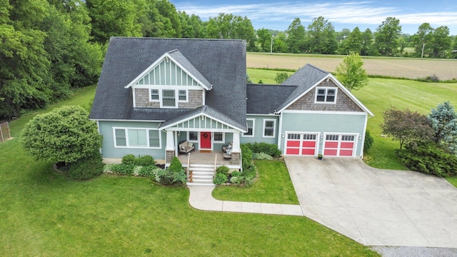 14980 Robins Rd, Johnstown, OH 43031 - view of front of property with covered porch, a front lawn, and driveway