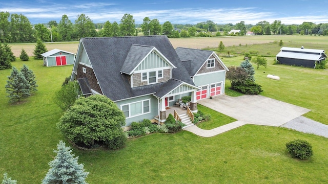 14980 Robins Rd, Johnstown, OH 43031 - view of front of home featuring concrete driveway, roof with shingles, and a front lawn