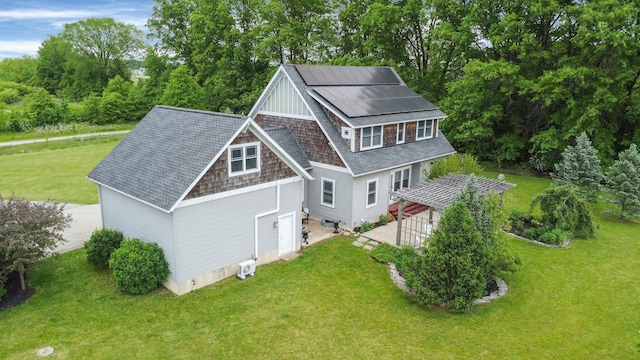 14980 Robins Rd, Johnstown, OH 43031 - rear view of house with a yard, a shingled roof, and view of wooded area