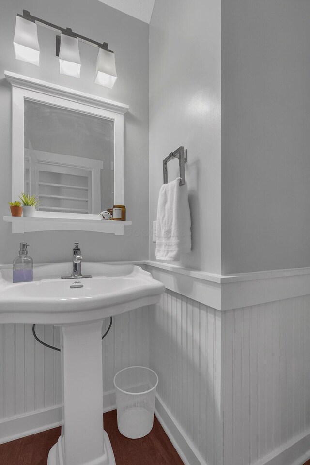 14980 Robins Rd, Johnstown, OH 43031 - half bathroom featuring wainscoting and wood finished floors