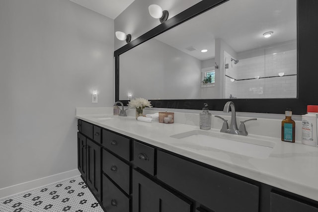 14980 Robins Rd, Johnstown, OH 43031 - full bathroom featuring double vanity, baseboards, and tiled shower