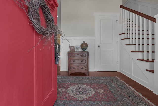 14980 Robins Rd, Johnstown, OH 43031 - foyer entrance featuring a decorative wall, a wainscoted wall, stairs, and wood finished floors