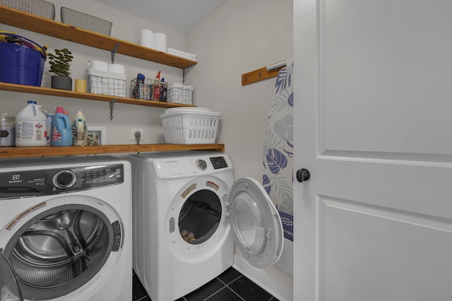 14980 Robins Rd, Johnstown, OH 43031 - laundry area featuring washer and dryer and dark tile patterned flooring