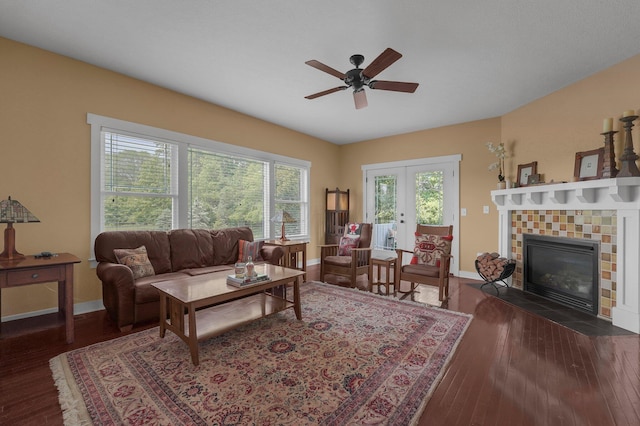 14980 Robins Rd, Johnstown, OH 43031 - living area with a ceiling fan, baseboards, french doors, wood-type flooring, and a tile fireplace