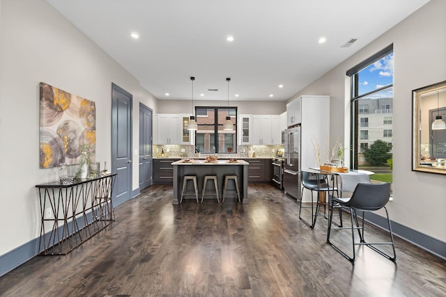 123 Aston Row Ln, Columbus, OH 43201 - dining room with dark wood-style flooring, recessed lighting, and baseboards