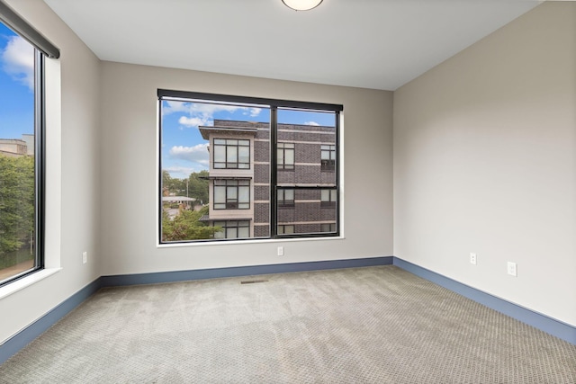 123 Aston Row Ln, Columbus, OH 43201 - carpeted empty room with baseboards