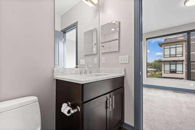 123 Aston Row Ln, Columbus, OH 43201 - bathroom featuring vanity, toilet, and baseboards