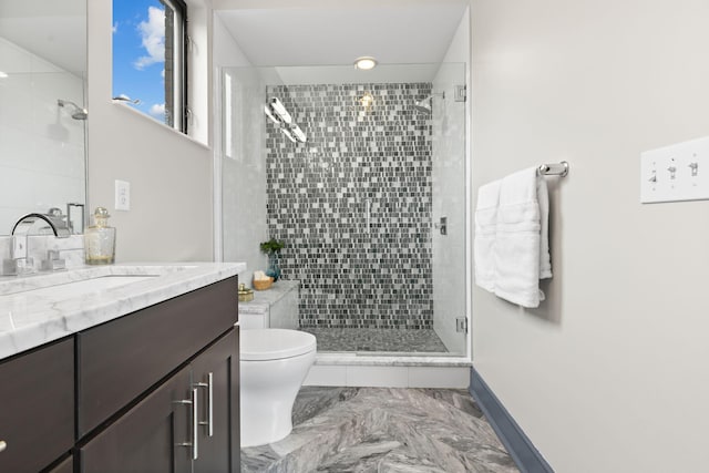 123 Aston Row Ln, Columbus, OH 43201 - bathroom featuring a stall shower, vanity, marble finish floors, toilet, and baseboards