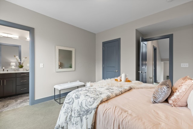 123 Aston Row Ln, Columbus, OH 43201 - bedroom featuring light colored carpet, a sink, ensuite bath, baseboards, and a closet