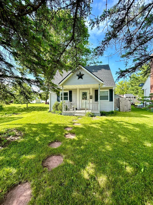 908 W 5th St, Marysville, OH 43040 - bungalow-style home with a porch, a front lawn, and a shingled roof