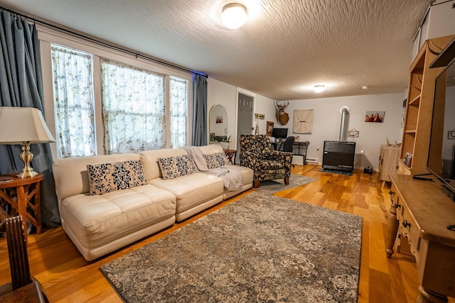 2719 Sulphur Lick Rd, Chillicothe, OH 45601 - living area with wood finished floors and a baseboard heating unit