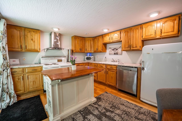 2719 Sulphur Lick Rd, Chillicothe, OH 45601 - kitchen with white appliances, wall chimney exhaust hood, wooden counters, a sink, and light wood-style flooring