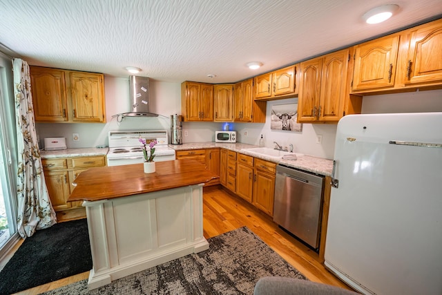2719 Sulphur Lick Rd, Chillicothe, OH 45601 - kitchen featuring white appliances, wall chimney range hood, a sink, light wood-style floors, and wood counters