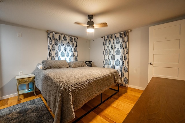 2719 Sulphur Lick Rd, Chillicothe, OH 45601 - bedroom with wood finished floors, baseboards, and a ceiling fan