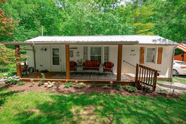2719 Sulphur Lick Rd, Chillicothe, OH 45601 - view of front of home featuring a porch, metal roof, and a front lawn