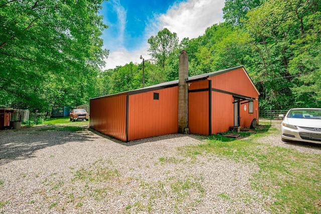 2719 Sulphur Lick Rd, Chillicothe, OH 45601 - view of side of home featuring a chimney, an outbuilding, and an outdoor structure