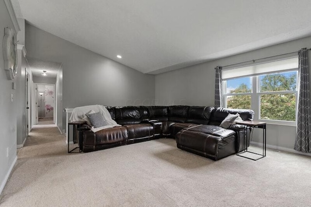 5208 Nightshadow Dr, Westerville, OH 43081 - carpeted living room featuring baseboards, lofted ceiling, and recessed lighting