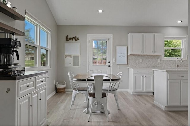 5208 Nightshadow Dr, Westerville, OH 43081 - dining area with healthy amount of natural light, light wood-type flooring, baseboards, and recessed lighting