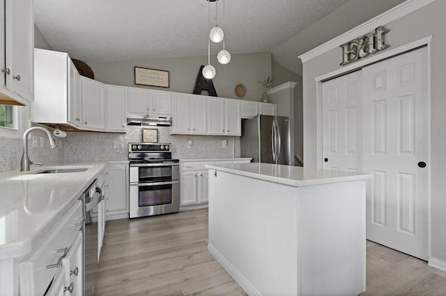 5208 Nightshadow Dr, Westerville, OH 43081 - kitchen with appliances with stainless steel finishes, a sink, exhaust hood, lofted ceiling, and backsplash