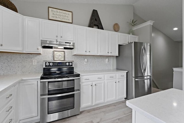 5208 Nightshadow Dr, Westerville, OH 43081 - kitchen featuring stainless steel appliances, under cabinet range hood, light wood finished floors, white cabinets, and vaulted ceiling