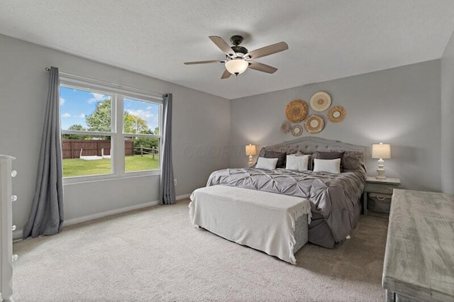 5208 Nightshadow Dr, Westerville, OH 43081 - bedroom featuring light carpet, baseboards, a textured ceiling, and ceiling fan