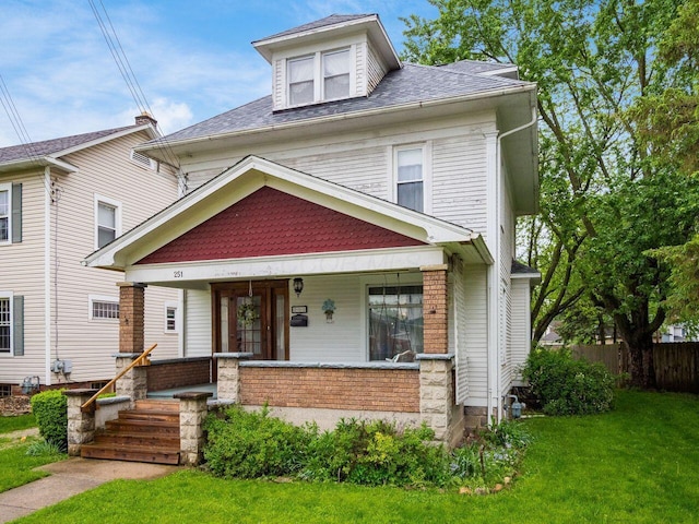 251 Summit St, Marion, OH 43302 - american foursquare style home featuring covered porch, brick siding, and a shingled roof