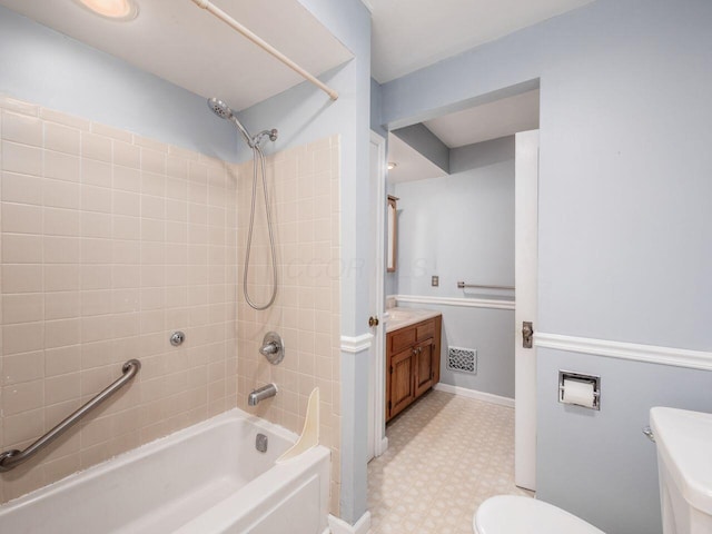 251 Summit St, Marion, OH 43302 - full bath featuring tile patterned floors, toilet, tub / shower combination, vanity, and baseboards