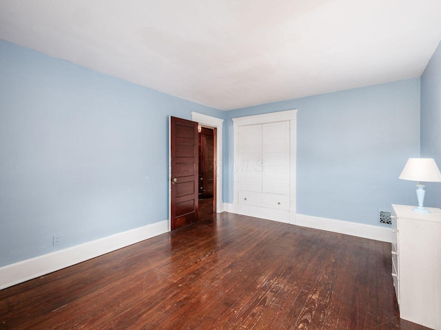 251 Summit St, Marion, OH 43302 - unfurnished bedroom featuring wood finished floors, baseboards, and a closet