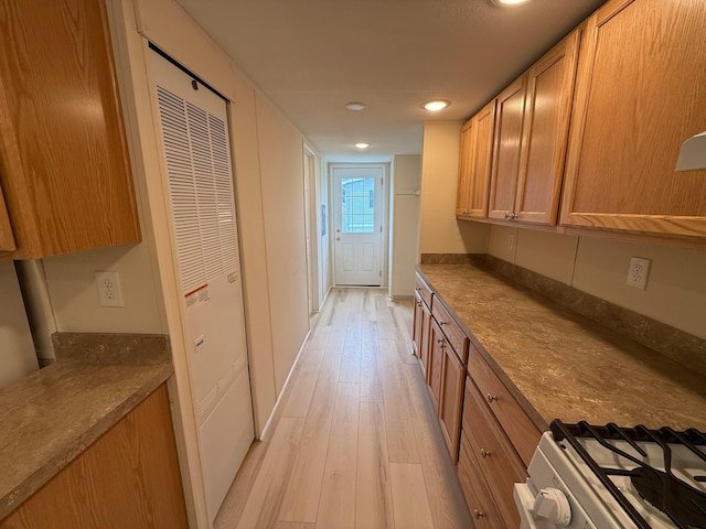 45 Winter Pine Dr, Delaware, OH 43015 - kitchen featuring white range with gas cooktop, a heating unit, light wood finished floors, recessed lighting, and brown cabinetry