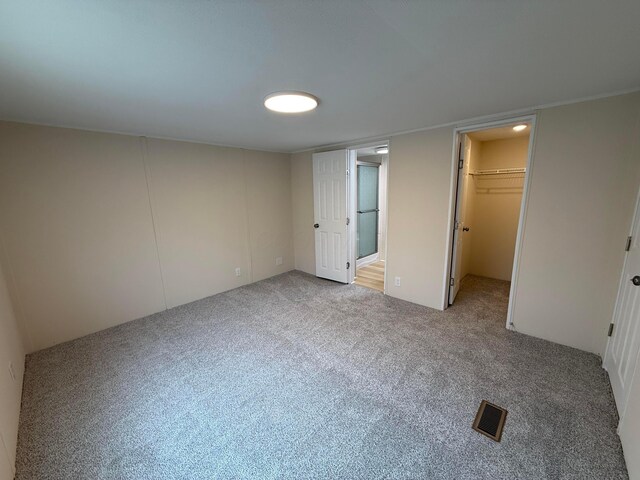 45 Winter Pine Dr, Delaware, OH 43015 - unfurnished bedroom with carpet flooring and a walk in closet