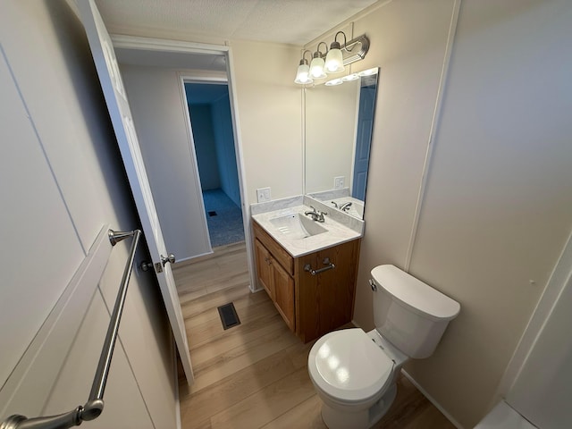 45 Winter Pine Dr, Delaware, OH 43015 - bathroom featuring vanity, toilet, and wood finished floors