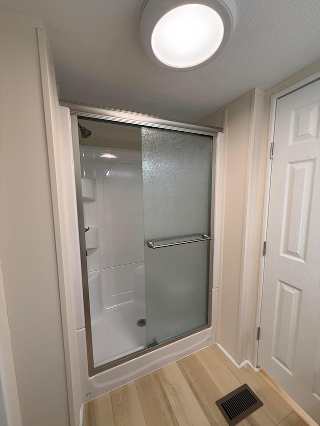 45 Winter Pine Dr, Delaware, OH 43015 - full bathroom featuring wood finished floors and a shower stall