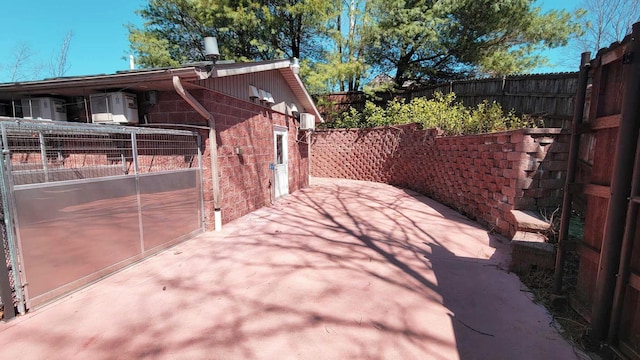 40455 Cone Rd, Albany, OH 45710 - view of side of home featuring a fenced backyard, a patio area, and brick siding