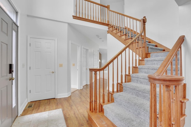 40455 Cone Rd, Albany, OH 45710 - entryway with a towering ceiling, wood finished floors, and stairs