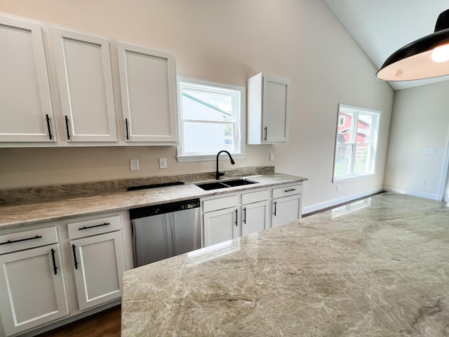 13541 Queen Rd NE, Thornville, OH 43076 - kitchen with a sink, stainless steel dishwasher, lofted ceiling, healthy amount of natural light, and white cabinetry