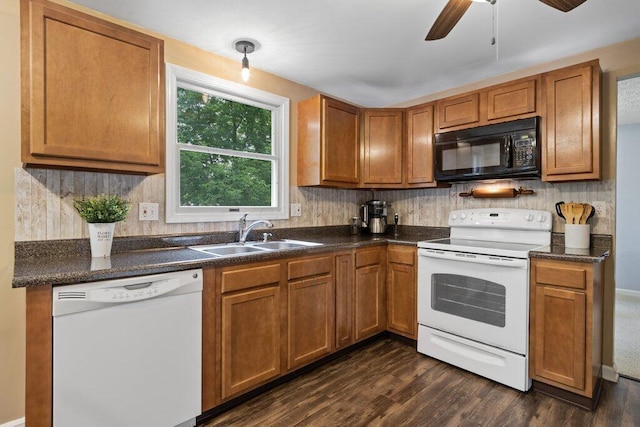 998 Timberbank Dr, Westerville, OH 43081 - kitchen with white appliances, a sink, dark wood-style floors, and dark countertops